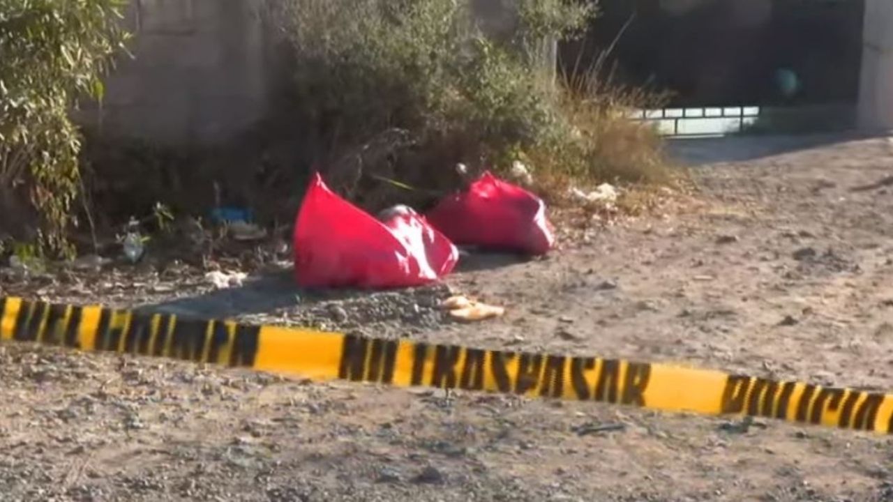 Hallan a dos encostalados en Tegucigalpa junto a un misterioso rótulo explicando su muerte