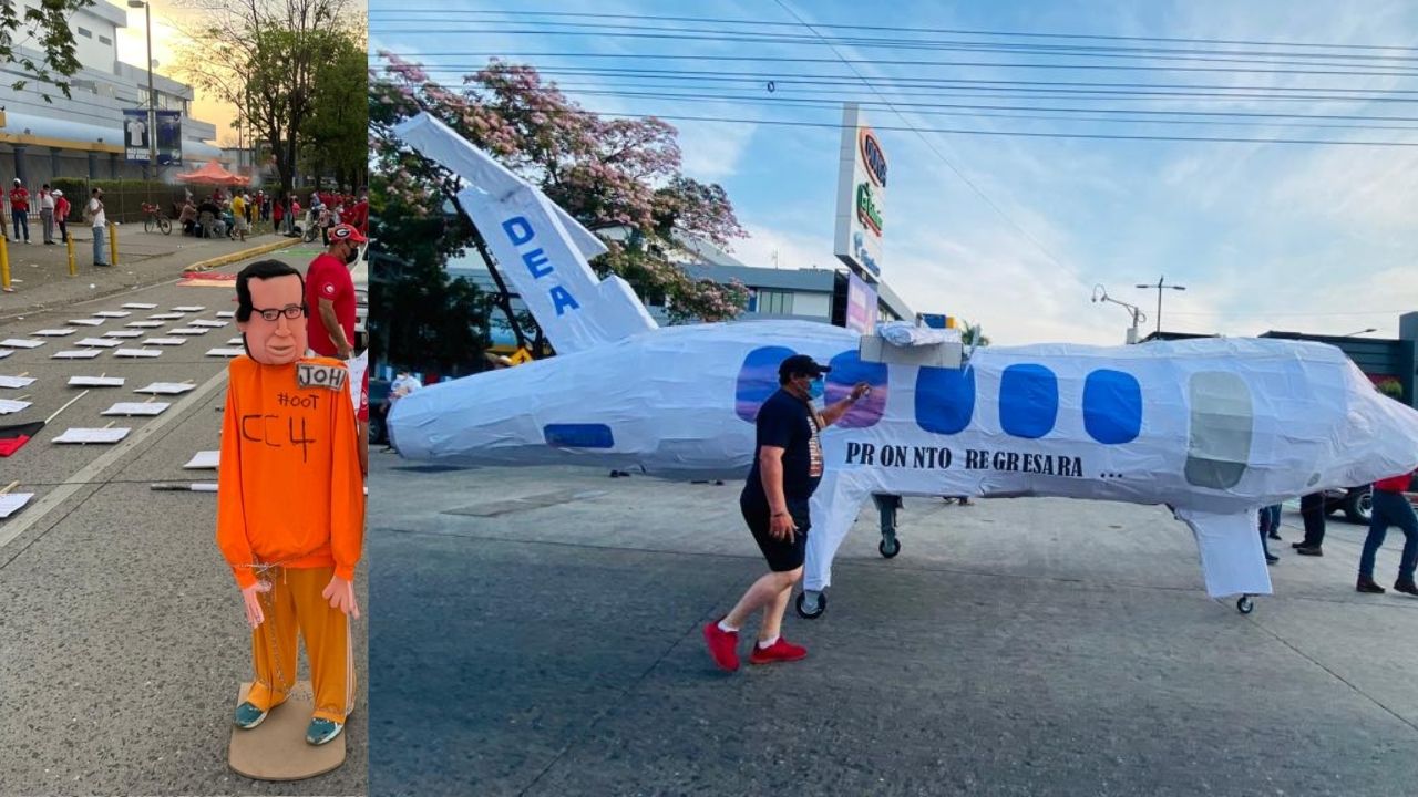 Imagen de Monigote de JOH vestido con traje de preso en EE. UU.  encabeza movilización de Día del Trabajador en SPS