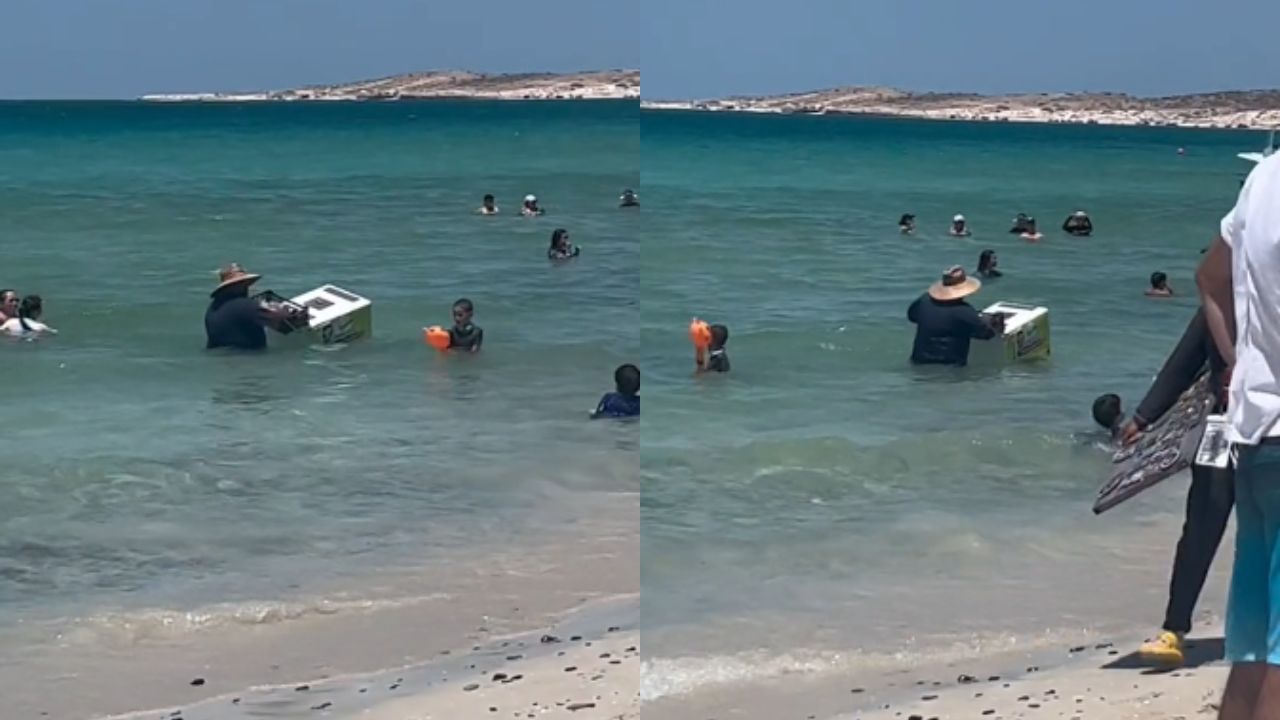 'El trabajo perfecto': Captan a hombre vendiendo helados en el mar