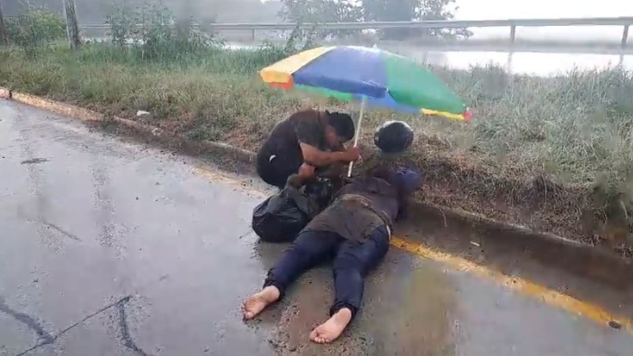 VIDEO: Motociclista hondureña  accidentada esperó ambulancia mientras familiar la cubría de la lluvia