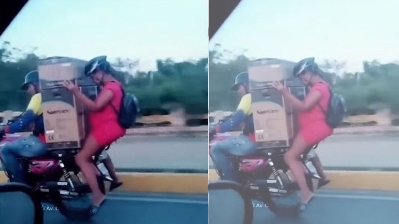 Embarazada en moto expone su vida y la del bebé al cargar un electrodoméstico