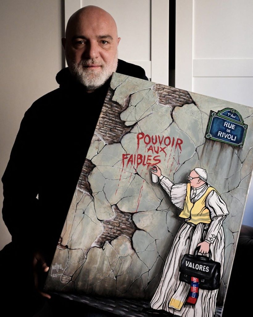 El dibujante Maupal con una de sus obras