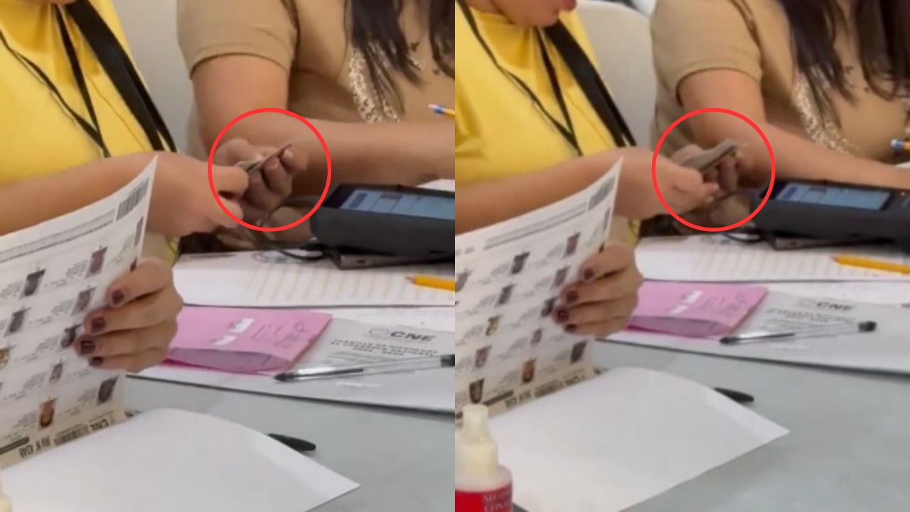 Graban a miembro de mesa electoral con varias DNI en su mano